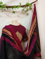 Black saree with intricately detailed zari border 