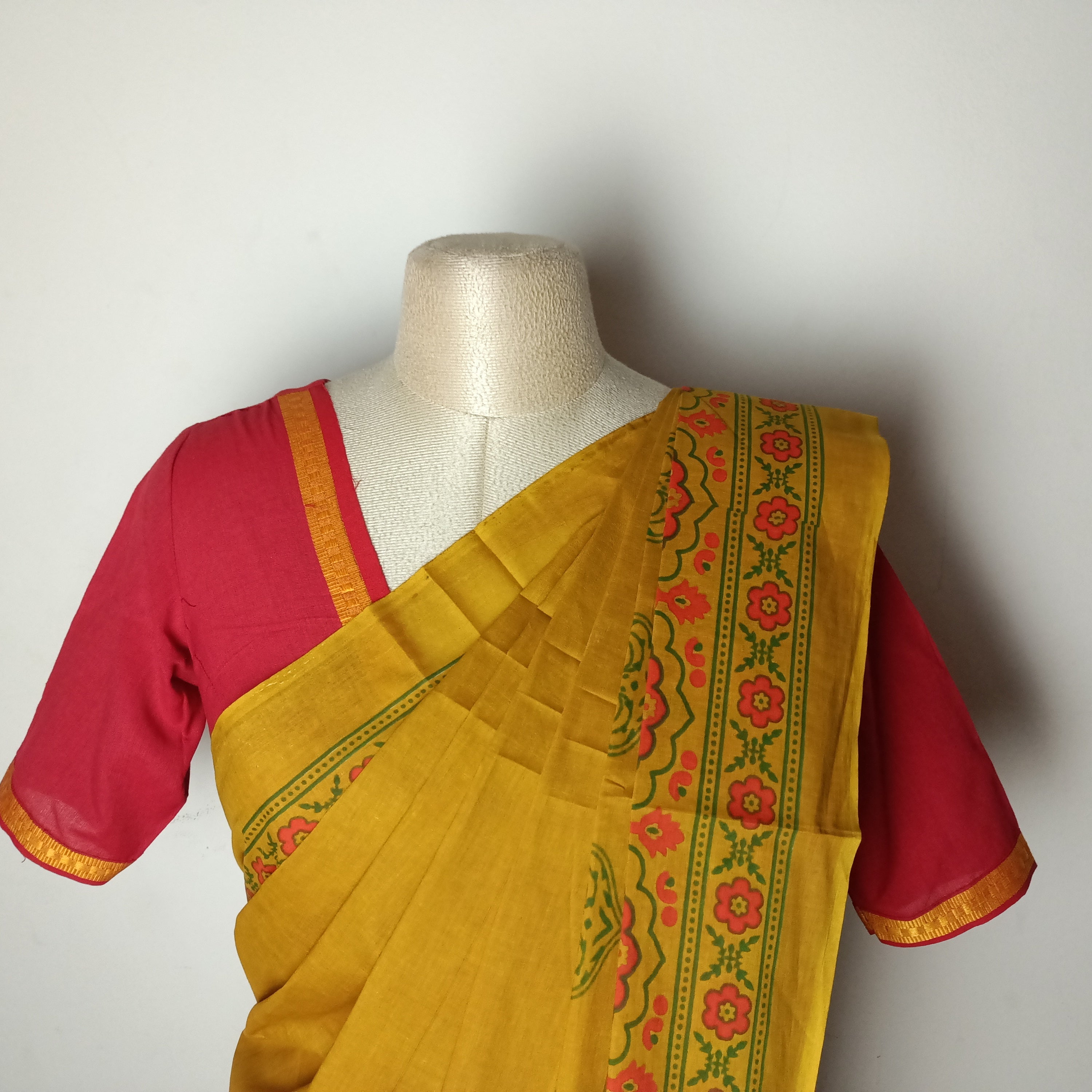 Yellow saree with red blouse combination