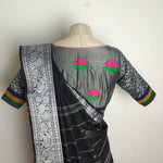 Black with grey border chettinad saree paired with a lotus khun blouse - Saree blouse combo